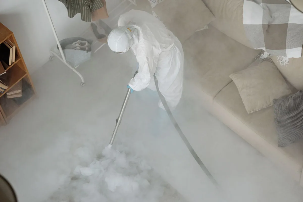 Biohazard cleanup technician in protective equipment, Abbeville, GA